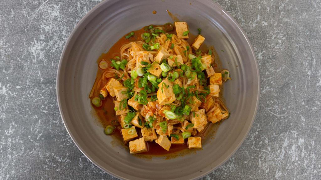 Shan Noodle · Rice Stick Noodle tossed in a tomato & five spice sauce w/ tofu. Garnished with chopped green onions. (Vegetarian)