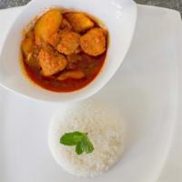 Chicken Curry · Cubed chicken cooked with potatoes, garlic, onion, ginger, chili paste, turmeric and authent...