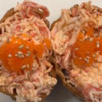 Spicy crab inari 2 pcs  · Tofu skin with spicy crab meat and rice , fish egg  on top