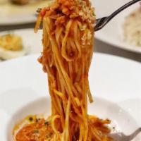 Tagliolini con Granchio · Spaghettini, Dungeness crab, tomato sauce, breadcrumbs.