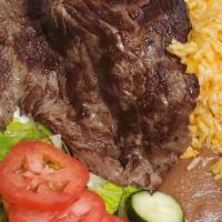 Carne Asada · Grilled beef marinated, rice, beans.