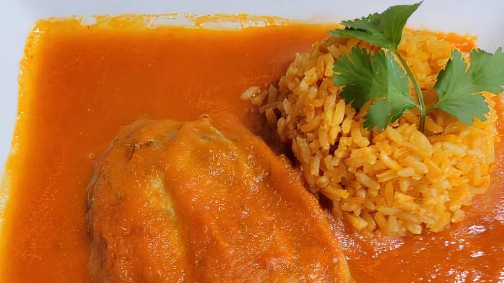 Chile Rellenos · Chili poblano stuffed with fresh cheese bathed in tomato sauce with rice, beans and corn tortillas.