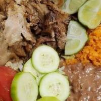 Carnitas plate · Pork, rice, beans, salad, and corn tortillas.
