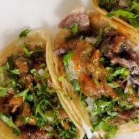 Tacos · Choice of meat with cilantro and onions.