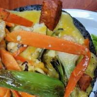 Molcajete De Mariscos · Hot molcajete filled with house spice salsa, sea food, mix with crab and garlic bread.