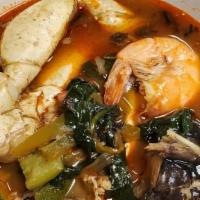 Sopa Siete Mares (Seafood Soup) · Vegetables, seafood, and hot soup, garlic bread.