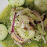 Aguachiles · Succulent shrimp marinated in a delicious and spicy green chile sauce, chili peppers, lime j...