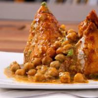 Samosa (2 Pieces) · Veggie turnover, stuffed with potatoes, green peas, herbs, and spices, served with chutney.