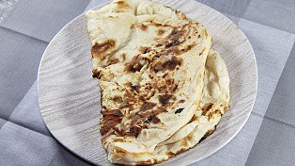 Plain Naan · Indian bread, baked in clay oven (layered with butter on request).