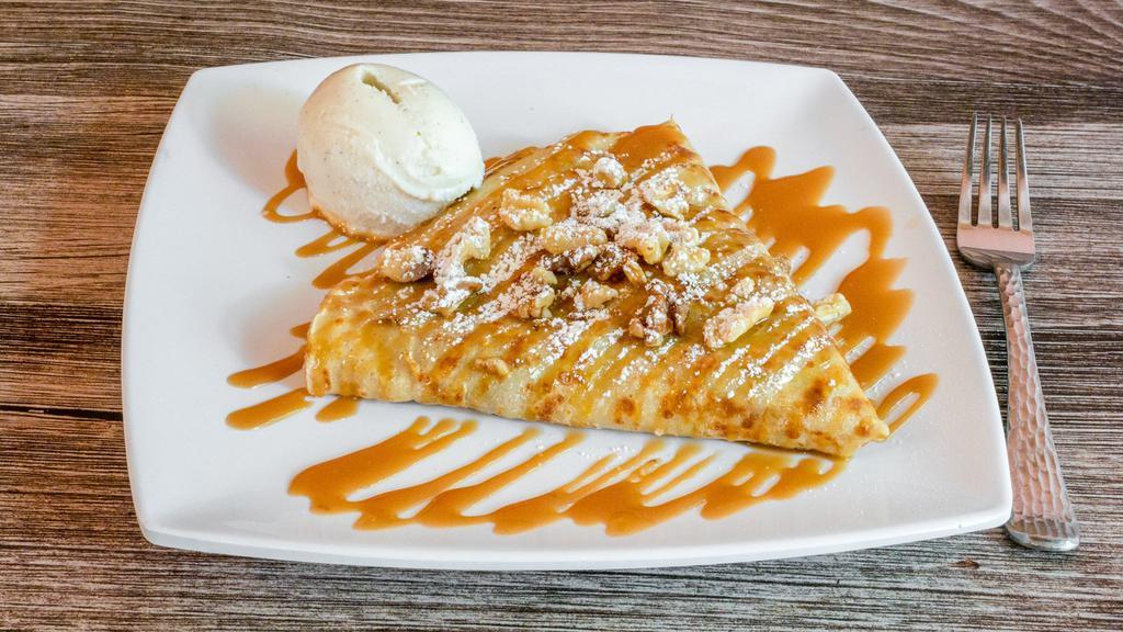 Cinnamon Apple French Toast · Cooked apples in cinnamon maple sauce, walnuts, caramel, powdered sugar. Served with french vanilla gelato.
