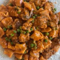Mezzemaniche Boscaiola · homemade short rigatoni pasta with our rich boscaiola sauce: tasty Italian sausage, wild mus...
