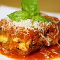 Parmigiana di melanzane · We layer slices of eggplant, creamy melted mozzarella cheese and san Marzano tomato sauce an...
