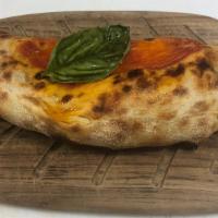 Calzone · The perfect stuffing: Mild spicy salami, wild mushrooms, thinly cut onions, tomato sauce and...