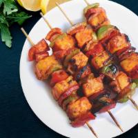 Grilled Paneer Tikka Kebob · Perfect oven roasted paneer cubes, onion and bell pepper marinated with spices and yogurt.