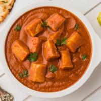 World Famous Paneer Tikka Masala · Delightful grilled paneer flavored with spiced tomato onion curry sauce.