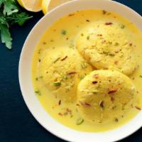 Tempting Rasmalai · Soft Paneer Balls immersed in chilled Creamy Milk garnished with Pistachio