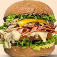 Creamy Shrooms Burger (Deluxe) · With added vegan cheese and vegan bacon on a crispy yet juicy GMO free soy patty on a bed of...