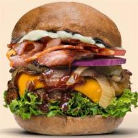 Smoky BBQ Burger (Deluxe) · With added vegan cheese and vegan bacon on a thick and succulent mushroom patty slathered in...