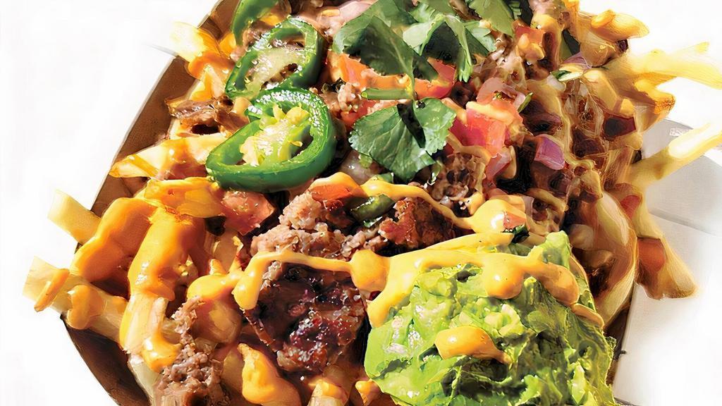 Carne Asada Fries · Impossible bits, The Uncreamery nacho cheese, pico de gallo, guacamole & caramelised jalapeño.