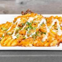 Cheesy Garlic Fries · Waffle fries, creamy garlic sauce, our special cheese blend, garlic flakes, seasoning, and c...