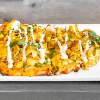 Spice of Punjab · Creamy red chili sauce, cheese, onions, bell peppers, grated ginger, choice of meat, cilantr...