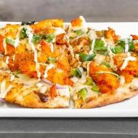 Tandoori Pizza · Creamy garlic sauce, cheese, onions, bell peppers, choice of meat, and cilantro.