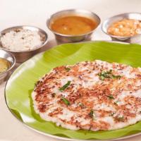 Onion Uthappam* · South Indian soft pancake made of rice & lentil topped with chopped onions.