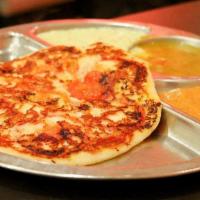 Tomato Uthappam* · South Indian soft pancake made of rice & lentil topped with sliced tomatoes.