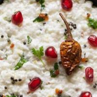 Yogurt Rice* · Soft cooked rice mixed with yogurt and tempered with spices. Served with Pickle.