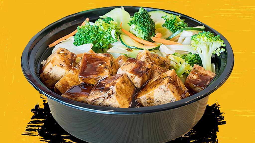 Tofu Teriyaki Bowl · Crisp tofu on the outside, soft on the inside. Our hand-cut tofu is fried then stir-fried in our house-made sauce and piled onto white rice, brown rice, fried rice or noodles and stir-fried veggies.