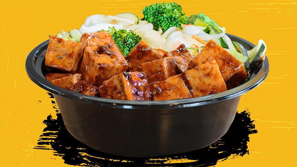 Spicy Tofu Bowl · Crisp tofu on the outside, soft on the inside. Our hand-cut tofu is fried then stir-fried in our house-made spicy sauce and piled onto white rice, brown rice, fried rice or noodles and stir-fried veggies.