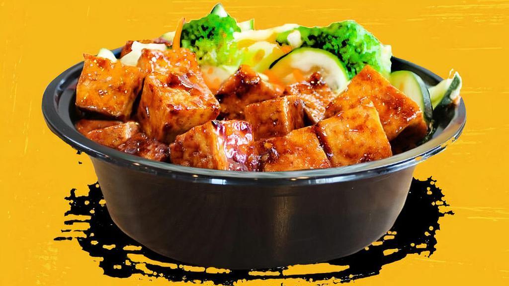 Mad Spicy Tofu Bowl · Crisp tofu on the outside, soft on the inside. Our Spicy Tofu is amazing, but you have to try this new MAD SPICY tofu wok-tossed with our new MAD SAUCE! Piled over your choice of white rice, brown rice, fried rice or noodles and includes stir-fry veggies! Even carnivores will love it!