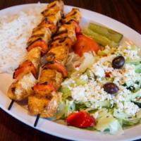 Chicken Kabob Plate · Two skewers of marinated chicken breast cubes with red bell peppers. Served with rice and Gr...