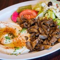 Lamb Shawarma · Lamb shawarma with hummus and Greek salad.