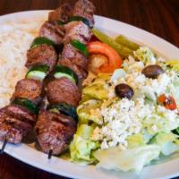 Lamb Kabob Plate · Two skewers of tender lamb cubes, mildly seasoned and broiled to perfection. Served with ric...