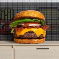 Sinful Bacon Cheese Burger · American beef patty topped with bacon, lettuce, tomato, onion, pickles, mayo and melted ched...