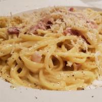 Linguini Carbonara  · Spaghettoni with Gunciale,Pecorino Romano, egg yolk & cracked black pepper.