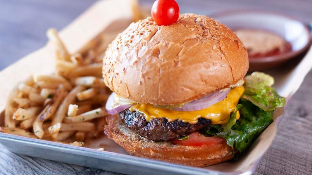 Cheeseburger · American cheese, lettuce, tomatoes, mustard, mayonnaise, pickles.