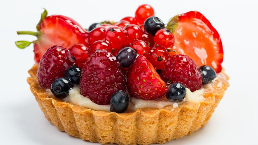 Assorted Fresh Fruit Tart · Fresh butterfly short dough tart filled with creme patissiere and seasonal fresh fruits which may include mango, kiwi, strawberries, raspberries, blackberries, and grapes. Topped with apricot glaze.