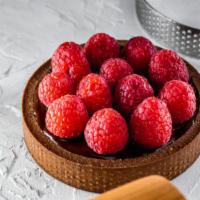 Baked Berries & Almond Tart · Butterfly short dough tart shell filled with frangipane, assorted berries, baked until golde...