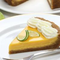Lime Curd Tart · Butterfly short dough tart shell filled with lime curd, sprinkled sugar topping, torched unt...