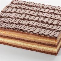 Opera Square · White sponge cake soaked in coffee syrup filled in with coffee butter cream and dark chocola...