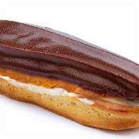 Chocolate Eclair · Fresh pate of choux puff, chocolate custard filling, garnished with chocolate curls.