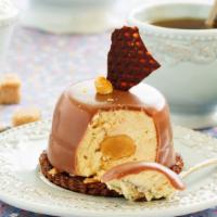 Caramel Mystique · Famous South American dessert with a tropical twist. Chocolate cake filled with dulce de lec...