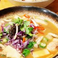 Vegan · Miso broth cooked with mushrooms, daikon radish, kelp, topped with stir fired asparagus, mus...