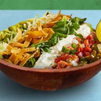 Fiesta Taco Salad · Choice of greens, corn, tomato, jalapenos, cilantro, guacamole, shredded cheese, sour cream,...