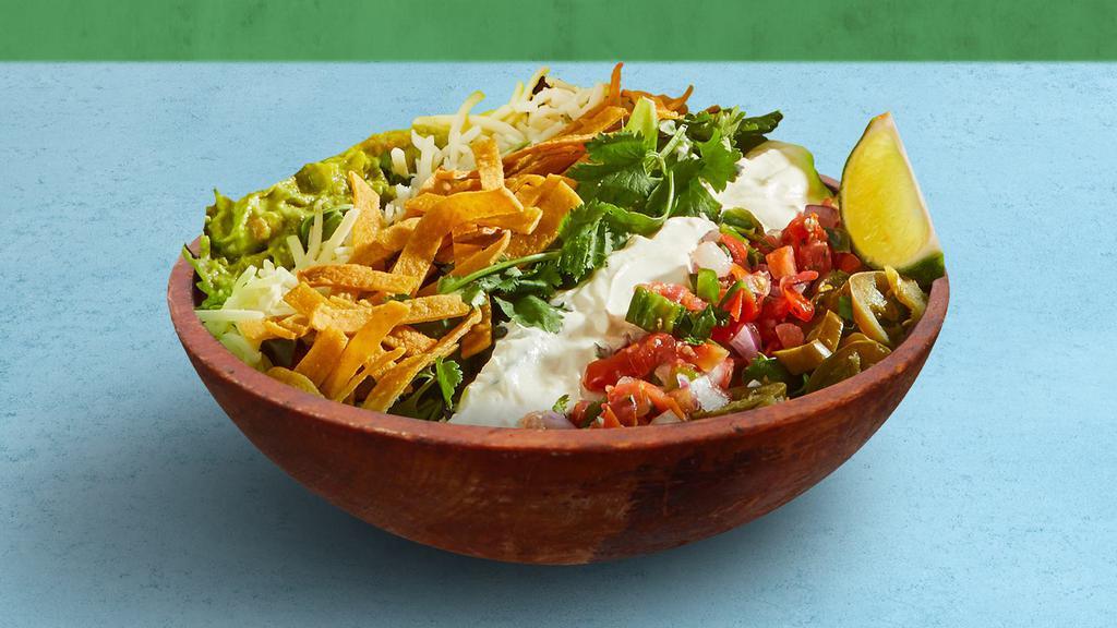 Fiesta Taco Salad · Choice of greens, corn, tomato, jalapenos, cilantro, guacamole, shredded cheese, sour cream, and tortilla chips, tossed with your choice of dressing.