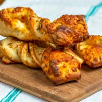 Garlic Parmesan Twists · Garlic parmesan twists are rolled fresh daily and baked to perfection with fresh garlic, our...