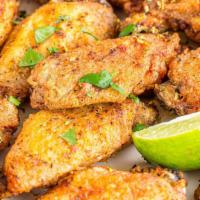 The Lemon Pepper Wings · Golden-crispy golden chicken wings with sizzling lemon pepper sauce made to perfection.