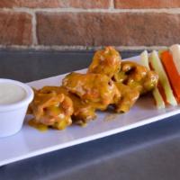 The Mango Habanero Wings · Golden-crispy golden chicken wings with sizzling mango habanero sauce made to perfection.